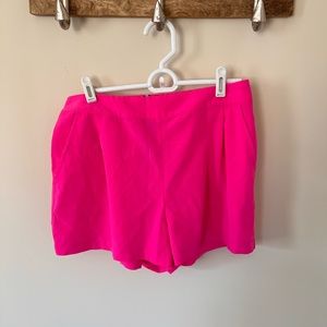 Hot pink shorts, gold zipper detail